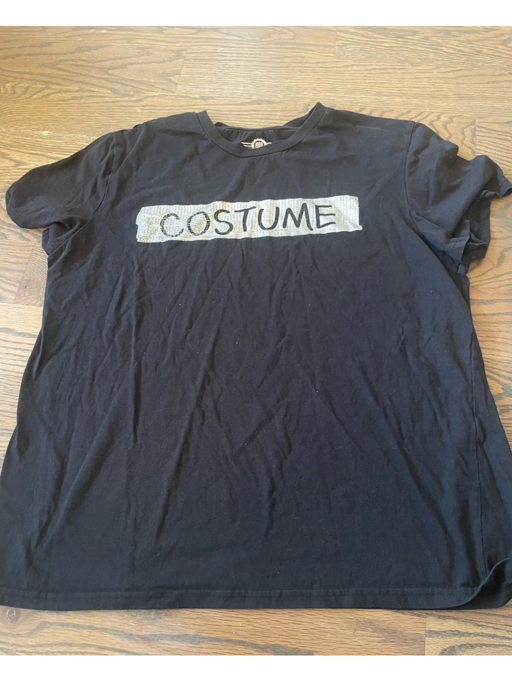 Black Tee with 'COSTUME' Text